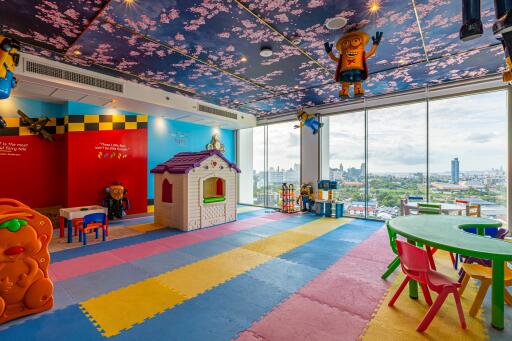 Colorful playroom with toys and large windows