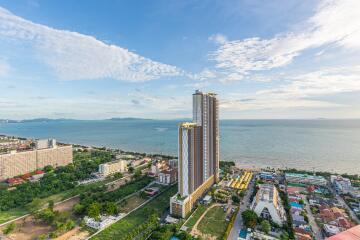 Aerial view of high-rise buildings by the coast