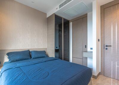 Modern bedroom with double bed and built-in wardrobe