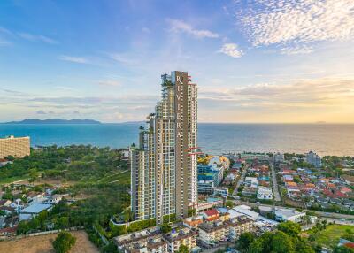 Aerial view of a high-rise building near the coastline