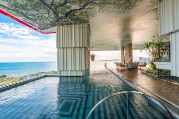 Luxurious terrace pool with ocean view and unique ceiling decor