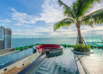 Rooftop pool area with ocean view