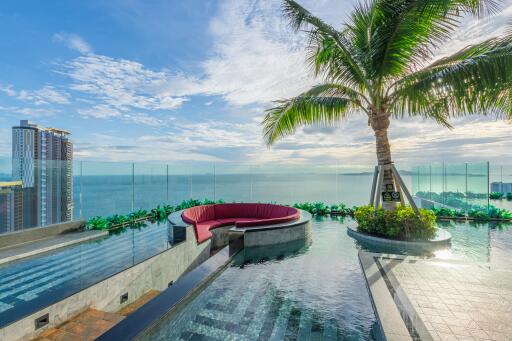 Rooftop pool area with ocean view