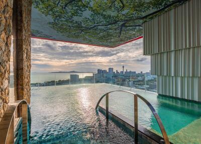 Outdoor infinity pool with city skyline view