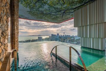 Outdoor infinity pool with city skyline view