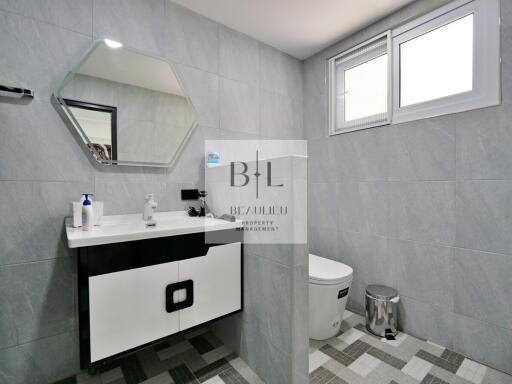 Modern bathroom with vanity and toilet