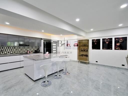 Modern kitchen with island and bar stools