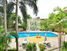 Luxurious outdoor pool area surrounded by greenery