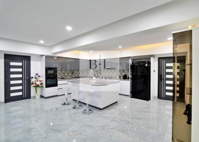 Modern kitchen with sleek design and white cabinetry