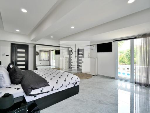 Spacious modern bedroom with en-suite balcony