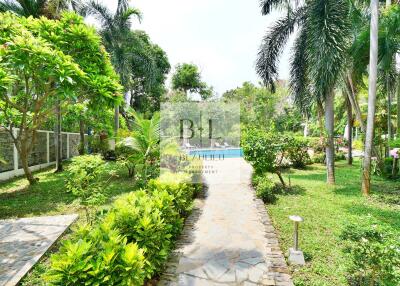 Beautiful garden with lush greenery and a stone pathway