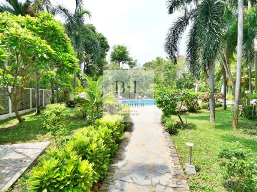 Beautiful garden with lush greenery and a stone pathway