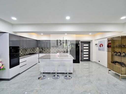 Modern kitchen with island and barstools