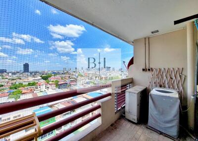 A balcony with a panoramic view of the city