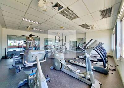 Residential gym with various exercise equipment