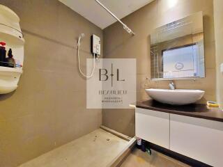 Modern bathroom with vanity and shower area