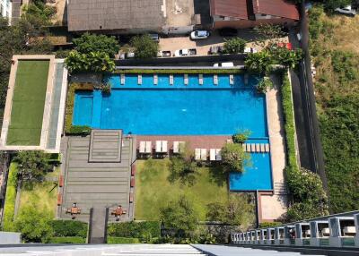 Aerial view of a residential complex with a swimming pool area