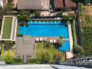 Aerial view of a residential complex with a swimming pool area