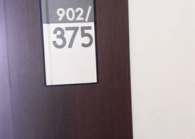 Close-up of apartment door with number