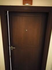 Apartment entrance door with a room number