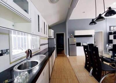 Modern kitchen with dining area and appliances