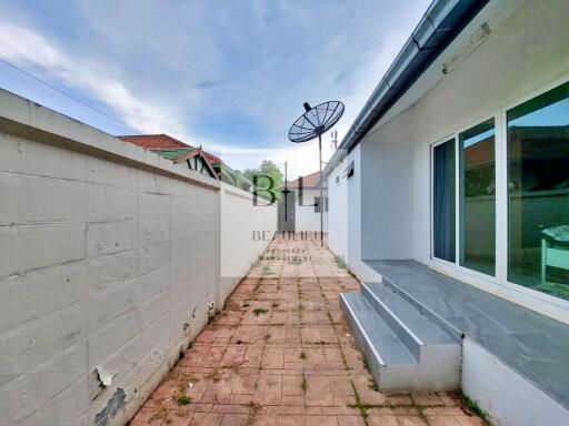 Outdoor space with satellite dish