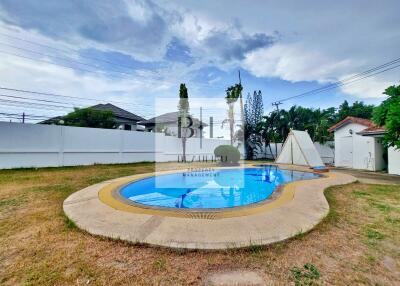 Outdoor swimming pool with surrounding patio
