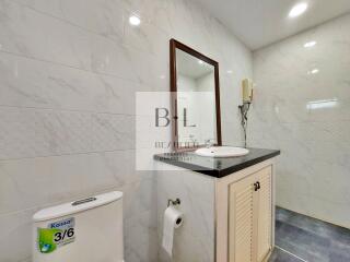 Modern bathroom with large mirror and sink