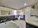 Modern bathroom with large bathtub and double sinks