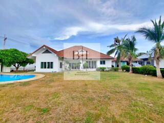 Exterior view of the property with backyard and pool