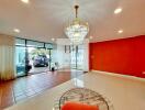 Spacious living room with chandelier and large windows