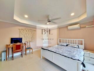 Spacious bedroom with natural light and modern amenities