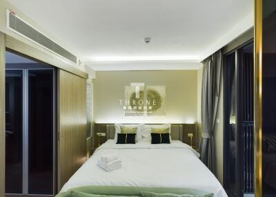Modern bedroom with double bed and contemporary lighting