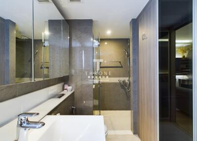 Modern bathroom with glass shower and vanity mirror
