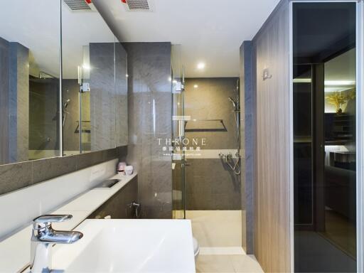 Modern bathroom with glass shower and vanity mirror