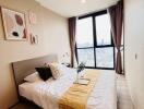 Spacious bedroom with a large window and double bed