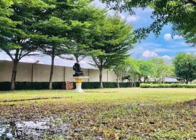 Well-maintained garden with trees and a fountain