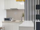 Modern kitchen with white cabinetry, countertop, and striped black and white wall design