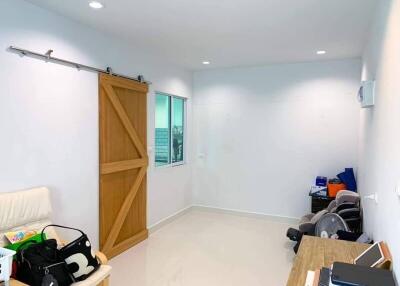 Bright room with sliding wooden door and window