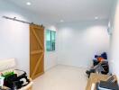 Bright room with sliding wooden door and window