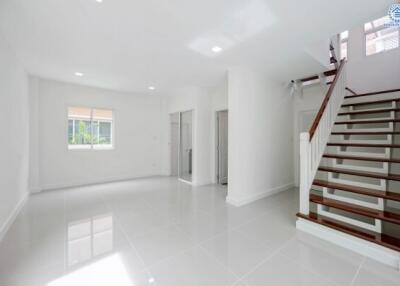 Spacious and bright main living area with stairway