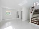 Spacious and bright main living area with stairway