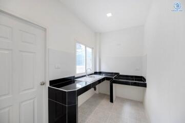 Modern kitchen with black and white countertops