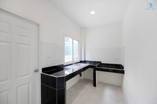 Modern kitchen with black and white countertops