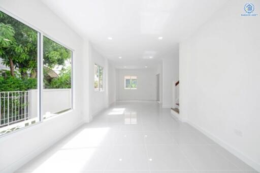 Spacious, well-lit living area with large windows