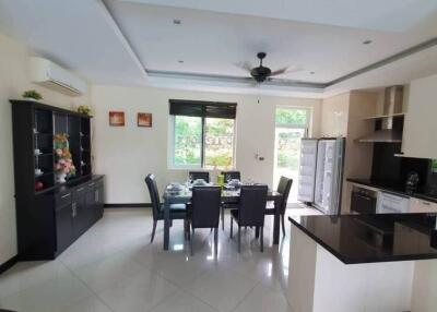 Modern dining area with adjacent kitchen