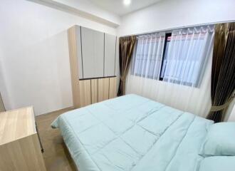 Modern bedroom with wardrobe and window