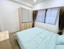 Modern bedroom with wardrobe and window