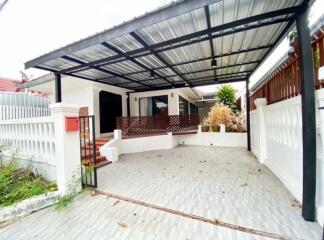 Image of the exterior of a house with a carport