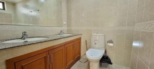 Spacious bathroom with double sinks and modern fixtures